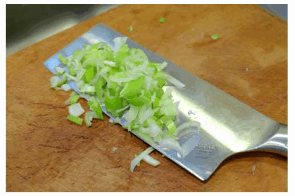 Placing ingredients on the Chinese cleaver
